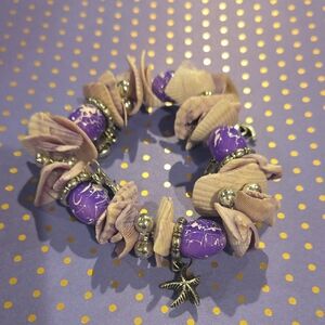 Purple and White Beaded Bracelet with Charms